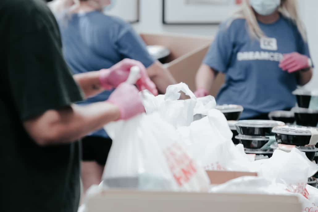 People working at a food bank volunteering for charity