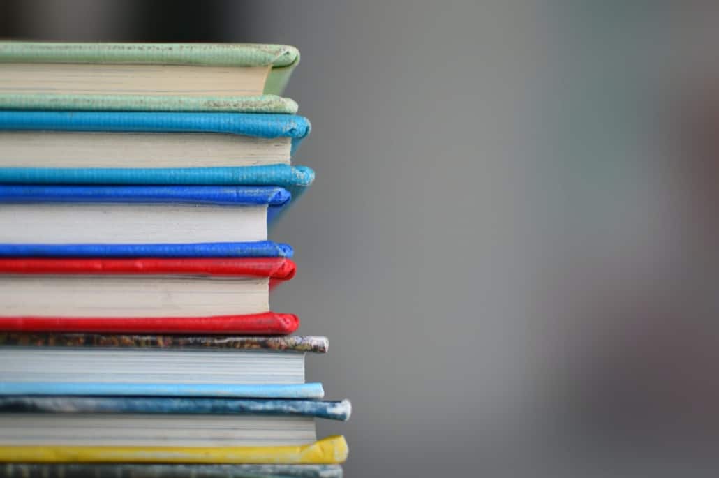 Stacked text books illustrating borrowing for education from RRSPs