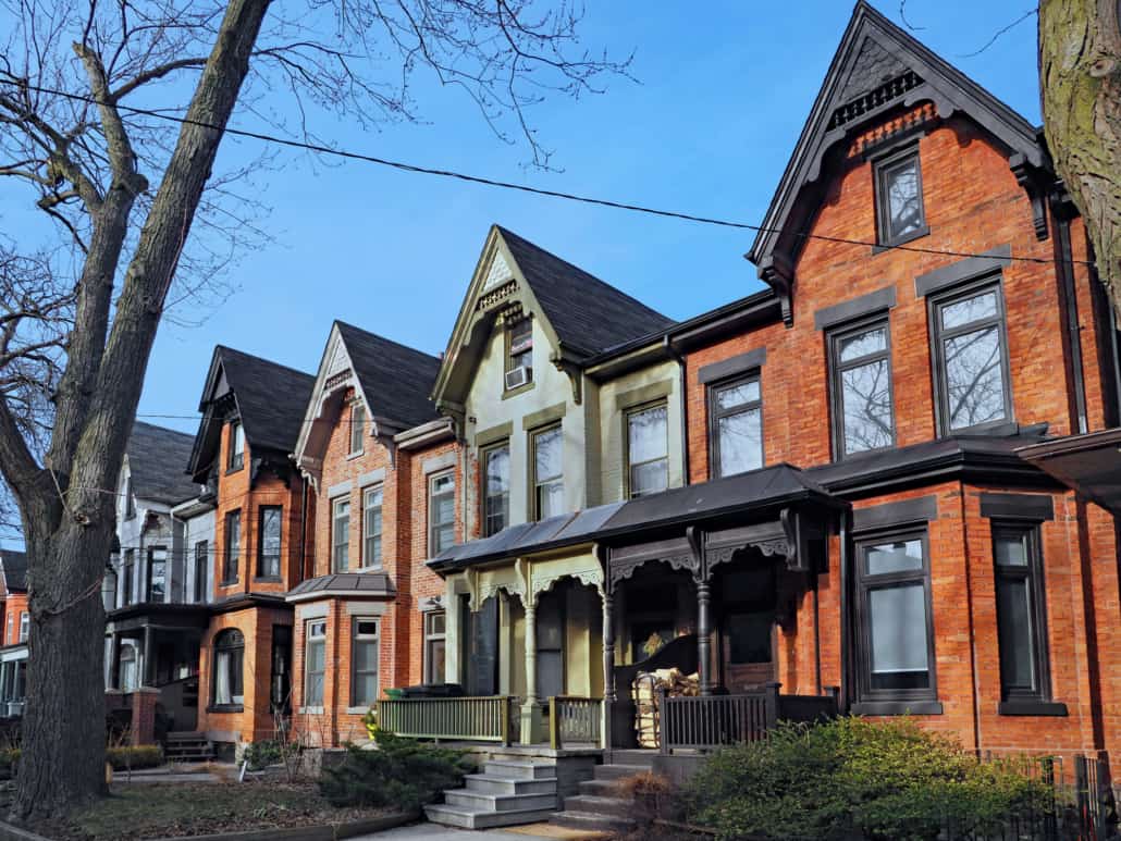 Row of old Victorian style brick houses with gables illustrating Underused Housing Tax extended again