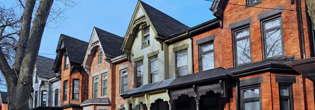 Row of old Victorian style brick houses with gables illustrating Underused Housing Tax extended again