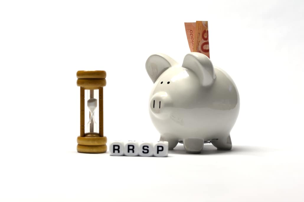 piggy bank and hour glass illustrating RRSP contribution deadline for 2023 
